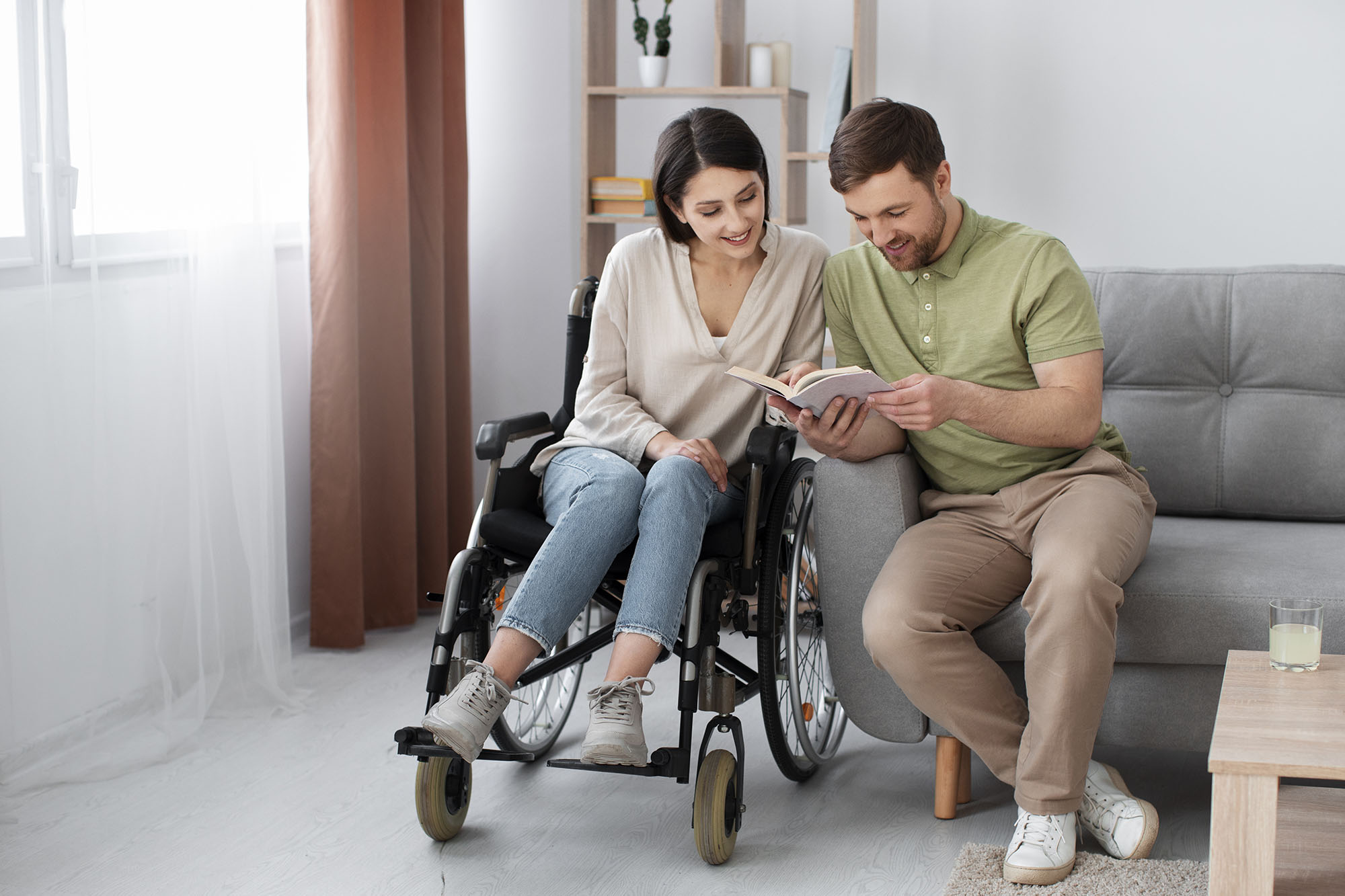 young-adult-reading-with-disabled-friend